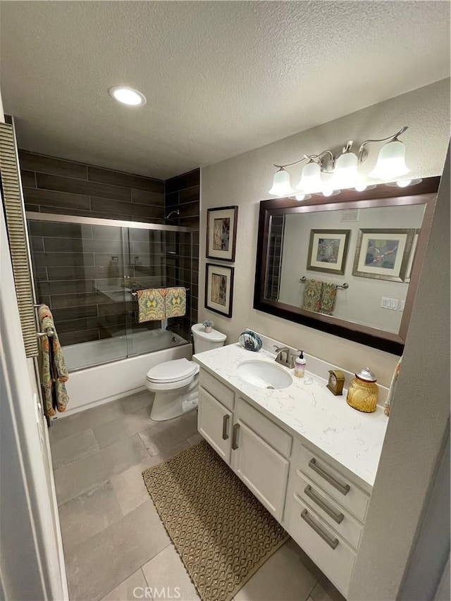 full bathroom with toilet, vanity, tile patterned floors, a textured ceiling, and shower / bath combination with glass door