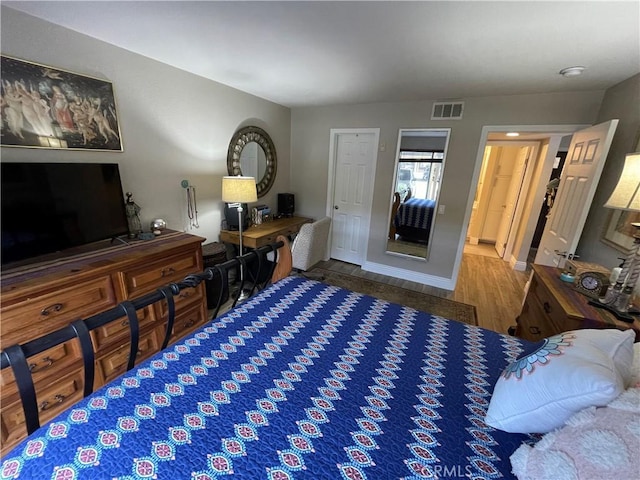 bedroom featuring wood-type flooring