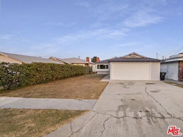 ranch-style house featuring a garage