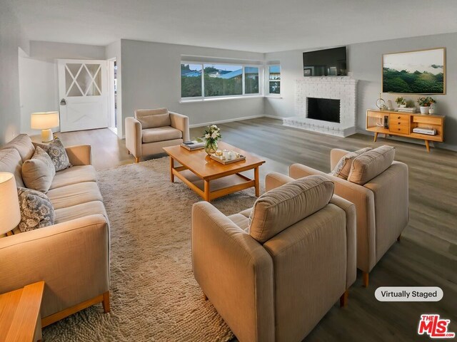 living room featuring a fireplace and hardwood / wood-style flooring