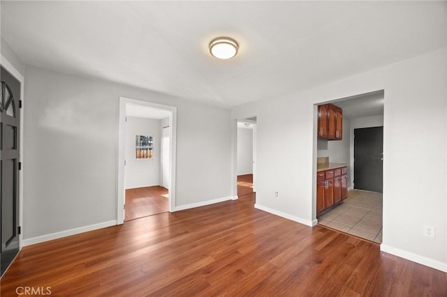 unfurnished living room with hardwood / wood-style floors