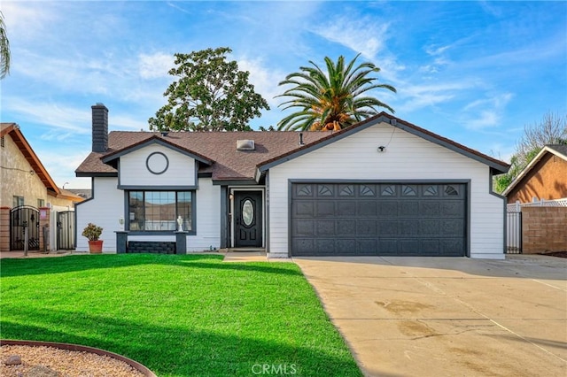 view of front of home featuring a garage and a front lawn