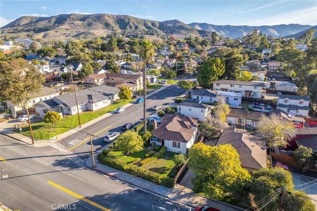 birds eye view of property with a mountain view