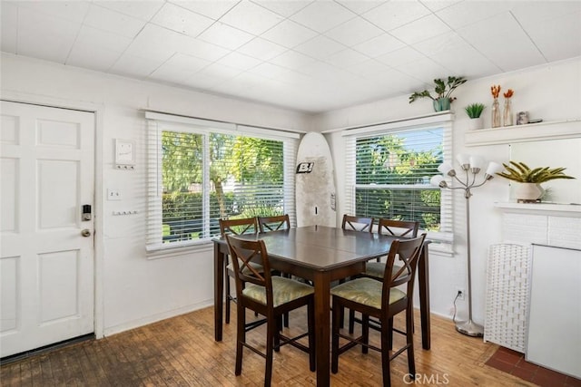 dining area with a healthy amount of sunlight and wood-type flooring