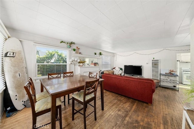 dining area with dark hardwood / wood-style floors