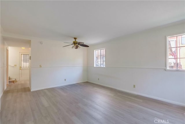 unfurnished room with ceiling fan and light hardwood / wood-style floors