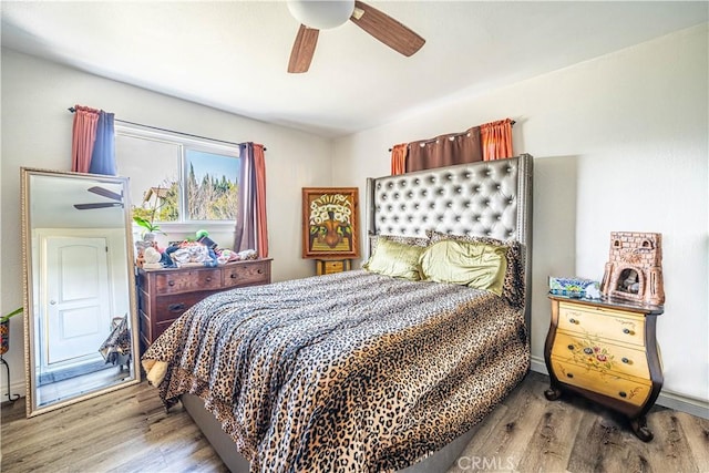 bedroom featuring light hardwood / wood-style flooring and ceiling fan