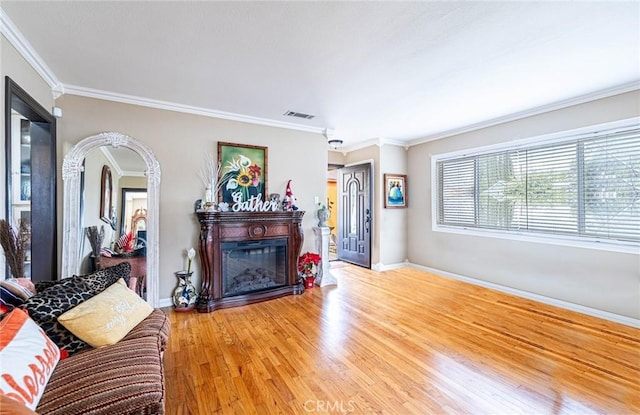 living room featuring hardwood / wood-style floors and ornamental molding