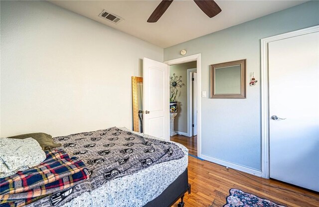 bedroom featuring ceiling fan and wood-type flooring