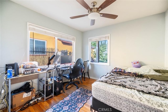 bedroom featuring ceiling fan and wood-type flooring