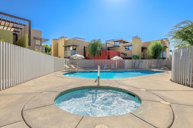 view of pool featuring a community hot tub