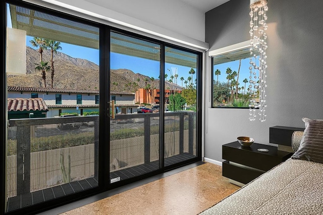 bedroom featuring a mountain view