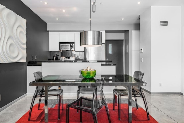 kitchen featuring backsplash and white cabinetry