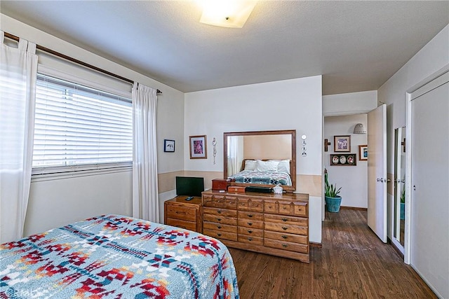 bedroom featuring dark hardwood / wood-style flooring