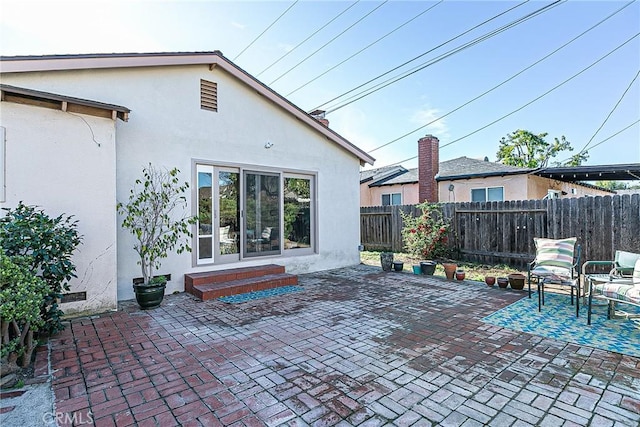 back of property featuring a patio area