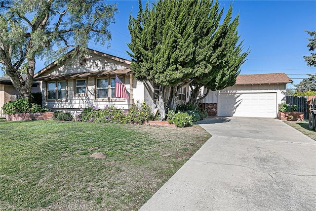 view of front of house with a front yard and a garage