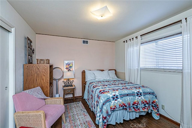 bedroom with hardwood / wood-style floors