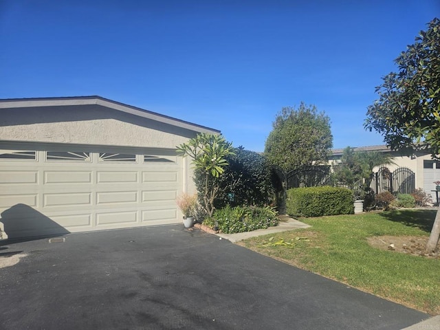 garage featuring a lawn