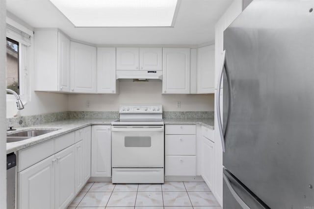 kitchen with sink, light tile patterned flooring, white cabinets, and appliances with stainless steel finishes