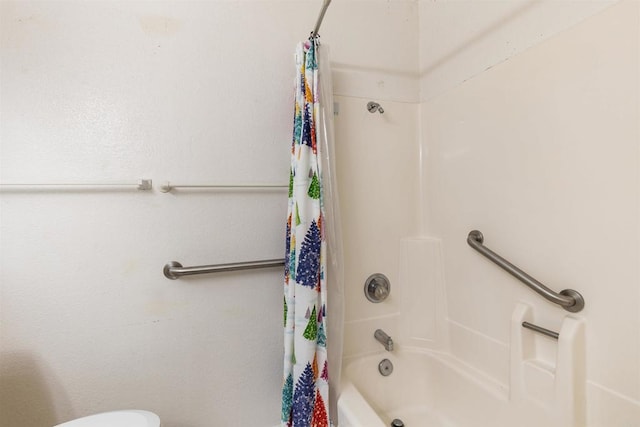 bathroom featuring shower / bath combo and toilet