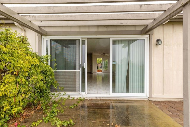 property entrance with a patio and a pergola