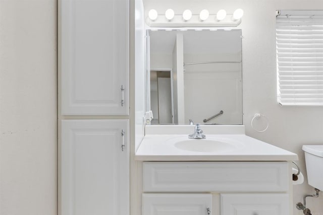 bathroom with vanity and toilet