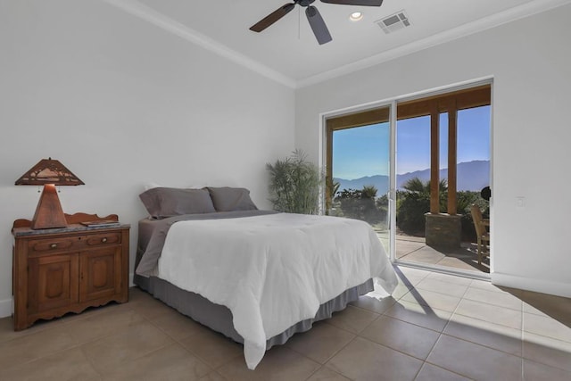 bedroom with light tile patterned floors, ornamental molding, a mountain view, ceiling fan, and access to exterior