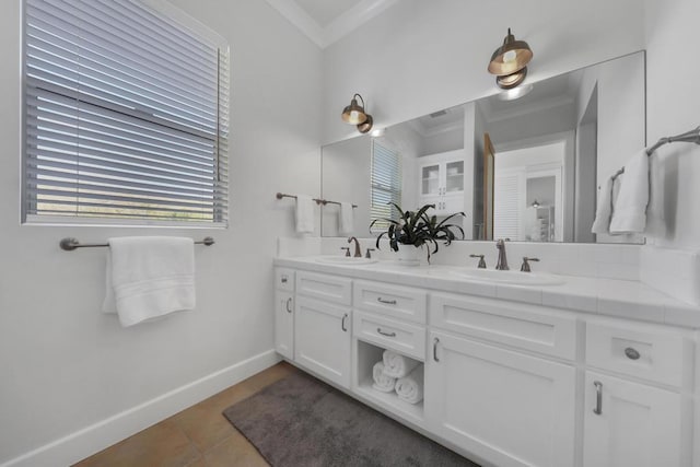 bathroom featuring crown molding, tile patterned floors, and vanity