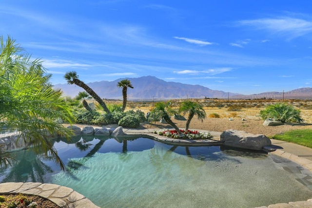 view of swimming pool featuring a mountain view