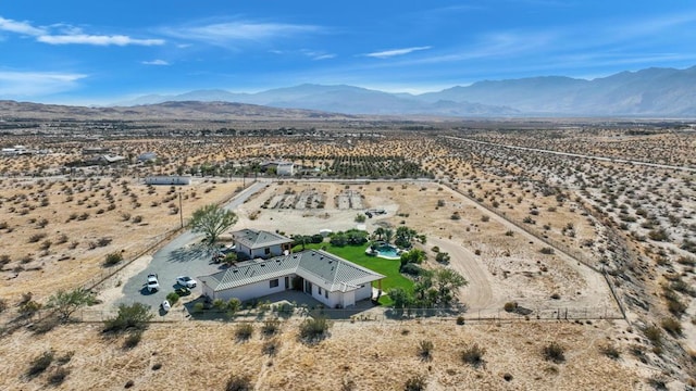 birds eye view of property featuring a mountain view