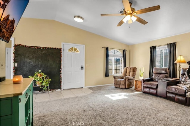 carpeted living room with vaulted ceiling and ceiling fan