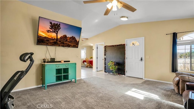 interior space featuring ceiling fan and vaulted ceiling