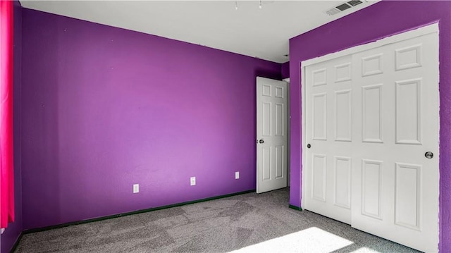 unfurnished bedroom with carpet floors