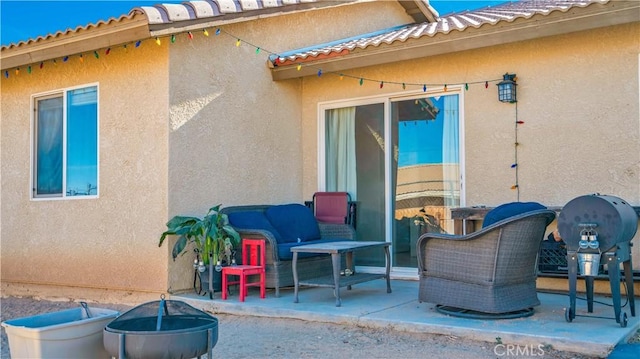 view of patio with a fire pit