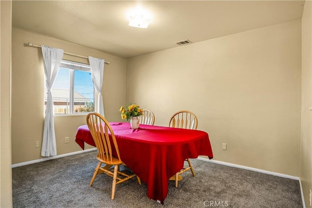 view of carpeted dining area