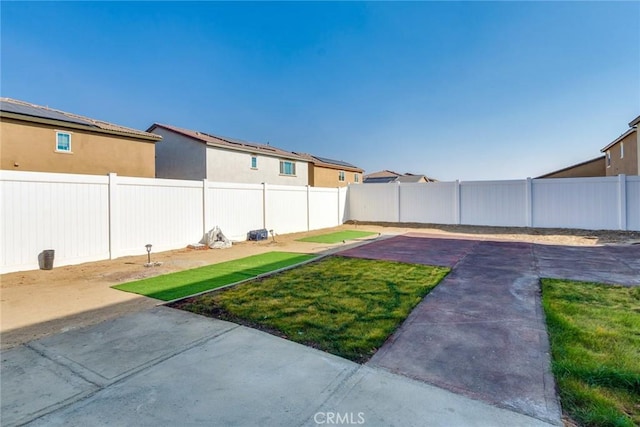 view of yard with a fenced backyard and a patio