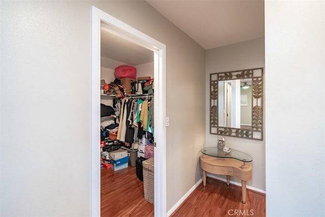 hall with hardwood / wood-style flooring