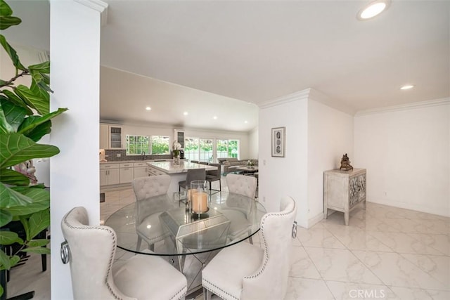 dining space featuring ornamental molding