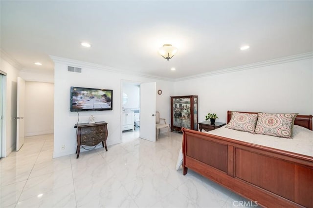 bedroom with ensuite bathroom and crown molding