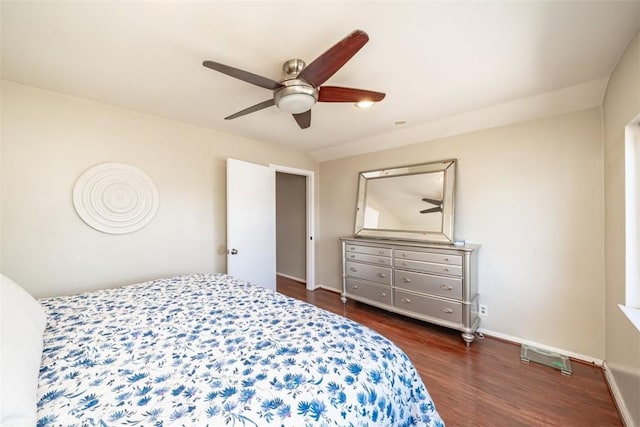 bedroom with ceiling fan and dark wood-type flooring