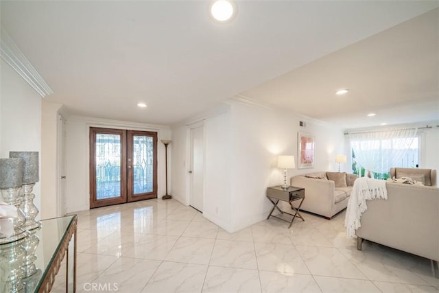 living room with french doors, plenty of natural light, and crown molding