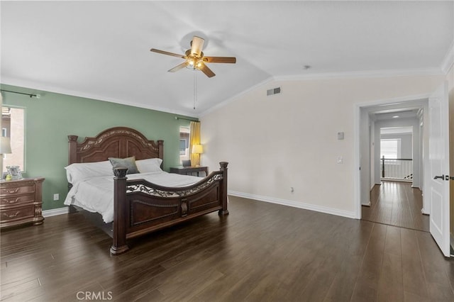 bedroom featuring ceiling fan, dark hardwood / wood-style floors, crown molding, and lofted ceiling