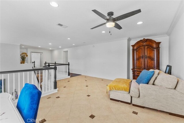 sitting room with light tile patterned floors, ceiling fan, and ornamental molding