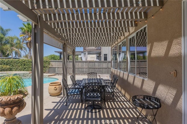 view of patio with a fenced in pool and a pergola