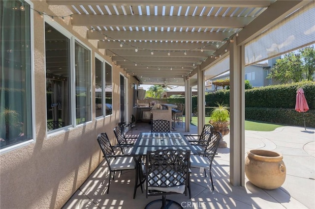 view of patio / terrace with a pergola and area for grilling