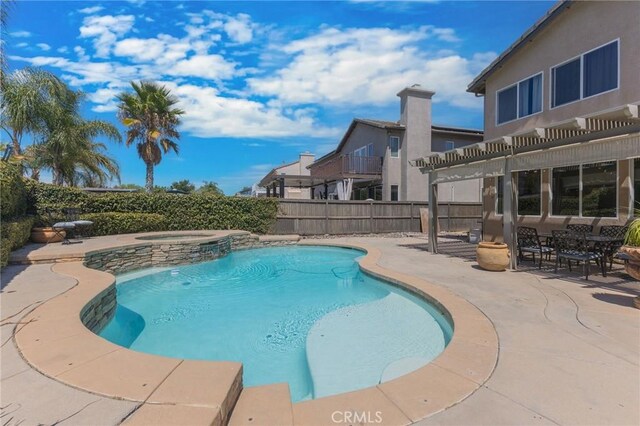 view of swimming pool with a pergola, a patio area, and an in ground hot tub