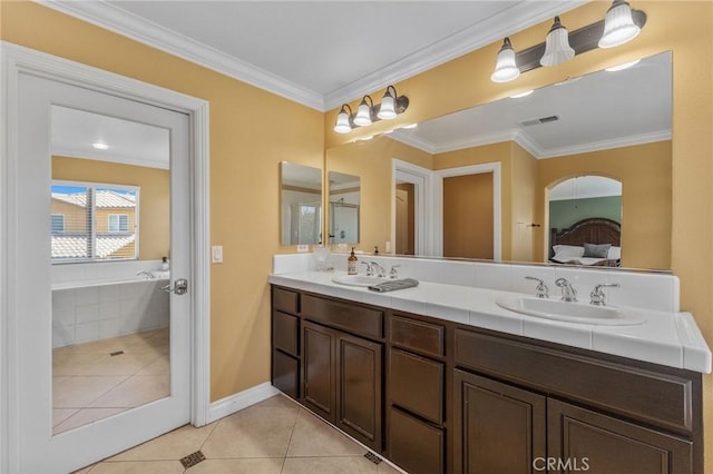 bathroom with tiled bath, tile patterned floors, vanity, and ornamental molding