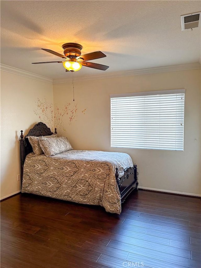 bedroom featuring ceiling fan, dark wood-type flooring, and crown molding