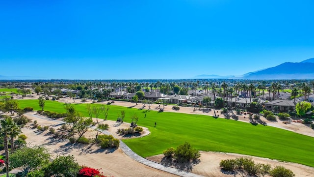 birds eye view of property with a mountain view