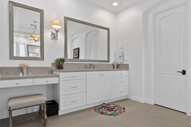 bathroom with tile patterned floors and vanity